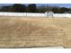 A spacious backyard with a white fence and storage shed at 149 Steep Rock Dr, Willow Springs, NC 27592