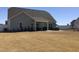 Spacious backyard offers a patio, hot tub, and white fence, perfect for outdoor activities at 149 Steep Rock Dr, Willow Springs, NC 27592