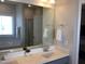 Bathroom with a double sink vanity, framed mirror, tub, and shower at 149 Steep Rock Dr, Willow Springs, NC 27592