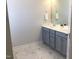 Bathroom with double sink vanity, framed mirror, and tile floor at 149 Steep Rock Dr, Willow Springs, NC 27592