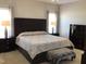 Serene bedroom with neutral tones, plush bedding, and ample natural light for a restful retreat at 149 Steep Rock Dr, Willow Springs, NC 27592