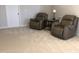 Comfortable sitting area features plush chairs, a side table, and ample space for relaxation at 149 Steep Rock Dr, Willow Springs, NC 27592
