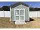 View of the exterior of a storage shed with a ramp and double doors at 149 Steep Rock Dr, Willow Springs, NC 27592