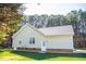 Side view of home with white door, siding, and well-manicured lawn at 1516 Bradsher Dr, Stem, NC 27581