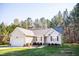 Charming single-story home with red shutters, attached garage, and manicured lawn at 1516 Bradsher Dr, Stem, NC 27581
