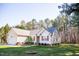 Charming single-story home with red shutters, attached garage, and manicured lawn at 1516 Bradsher Dr, Stem, NC 27581