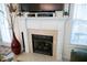 Elegant fireplace with white mantel and stone surround, perfect for cozy evenings at 1516 Bradsher Dr, Stem, NC 27581