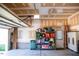 Spacious garage with plenty of room for storage, shelving, and a door leading to the exterior at 1516 Bradsher Dr, Stem, NC 27581
