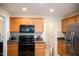 Well-equipped kitchen features modern appliances, granite counters, and ample cabinet space at 1516 Bradsher Dr, Stem, NC 27581