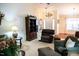 Cozy living room featuring plush seating, a fireplace, and a beautiful display case at 1516 Bradsher Dr, Stem, NC 27581