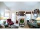 Cozy living room with a fireplace and comfortable seating at 1516 Bradsher Dr, Stem, NC 27581