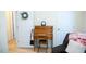 Home office space with a roll-top desk and chair, set against a backdrop of neutral walls at 1516 Bradsher Dr, Stem, NC 27581
