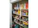 Well-stocked pantry with shelving and ample storage space for food and household items at 1516 Bradsher Dr, Stem, NC 27581