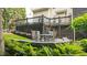 A patio on the back deck features a table and chairs, perfect for outdoor dining and relaxation at 1721 Frenchwood Dr, Raleigh, NC 27612