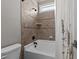Cozy bathroom featuring a shower/tub combination with decorative tile and neutral paint colors at 1721 Frenchwood Dr, Raleigh, NC 27612