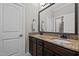 Bathroom featuring a double vanity with granite countertops, and a large mirror at 1721 Frenchwood Dr, Raleigh, NC 27612