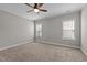 Cozy bedroom features neutral paint colors, carpeted floors, and two windows for natural light at 1721 Frenchwood Dr, Raleigh, NC 27612