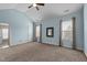 Spacious bedroom features carpeted floors, a ceiling fan, and two windows at 1721 Frenchwood Dr, Raleigh, NC 27612