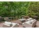 Beautiful wood deck with comfortable seating, perfect for outdoor relaxation amidst lush greenery at 1721 Frenchwood Dr, Raleigh, NC 27612