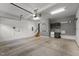 Spacious garage with ample room for parking and storage, featuring cabinets and utility sink for convenience at 1721 Frenchwood Dr, Raleigh, NC 27612