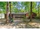 Expansive backyard featuring a screened sunroom and lush trees providing privacy at 1801 Irish Blvd, Sanford, NC 27332