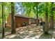 Backyard with wooded border offering privacy, a grill and lush surroundings at 1801 Irish Blvd, Sanford, NC 27332
