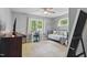 Serene bedroom with a desk, daybed, soft lighting, and neutral tones at 1801 Irish Blvd, Sanford, NC 27332