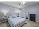 Relaxing bedroom with a ceiling fan, neutral paint and carpet, and a wood bookcase at 1801 Irish Blvd, Sanford, NC 27332