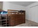 This bedroom has a bed with drawers and shelves and a white closet at 1801 Irish Blvd, Sanford, NC 27332