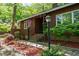 Inviting front entrance with brick steps, wrought iron railing, and colorful landscaping at 1801 Irish Blvd, Sanford, NC 27332