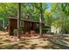 Well-maintained home featuring brick accents, an attached garage, and mature trees at 1801 Irish Blvd, Sanford, NC 27332