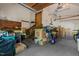 Spacious garage leading to wooden stairs, packed with moving boxes and household items at 1801 Irish Blvd, Sanford, NC 27332