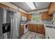 Kitchen features oak cabinets, stainless appliances, and eat-in countertops at 1801 Irish Blvd, Sanford, NC 27332