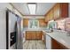 Kitchen featuring stainless steel appliances and a window offering a view of the outdoors at 1801 Irish Blvd, Sanford, NC 27332