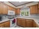 Updated kitchen with oak cabinets, white appliances and ample counter space at 1801 Irish Blvd, Sanford, NC 27332