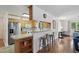 Kitchen with wooden cabinets, stainless steel appliances, and seating at the breakfast bar at 1801 Irish Blvd, Sanford, NC 27332
