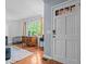 Bright living room featuring hardwood floors, large windows, and a view of the outdoors at 1801 Irish Blvd, Sanford, NC 27332