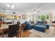 Open concept living space featuring hardwood floors and a modern sectional at 1801 Irish Blvd, Sanford, NC 27332