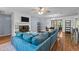 Spacious living area featuring a fireplace, large sectional sofa, and access to the outdoor dining area at 1801 Irish Blvd, Sanford, NC 27332