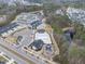 Aerial view showcasing the community pool, playground, pond, and neighborhood at 1916 Edens Ridge Ave, Wake Forest, NC 27587