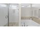 Modern bathroom featuring a glass-enclosed shower and a soaking tub with tile surround at 1916 Edens Ridge Ave, Wake Forest, NC 27587