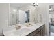 Bathroom featuring double sinks, a large mirror, and a view to the bedroom and shower at 1916 Edens Ridge Ave, Wake Forest, NC 27587