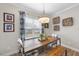 Bright dining area featuring a modern table, bench, and decorative accents at 1916 Edens Ridge Ave, Wake Forest, NC 27587