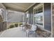 Cozy front porch with seating and stone accents, perfect for enjoying the outdoors at 1916 Edens Ridge Ave, Wake Forest, NC 27587