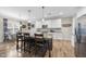Kitchen island with granite countertops, stainless steel appliances, and pendant lighting at 1916 Edens Ridge Ave, Wake Forest, NC 27587