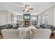 Cozy living room features a stone fireplace, built-in shelving, and comfortable seating at 1916 Edens Ridge Ave, Wake Forest, NC 27587