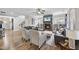 Inviting living room with a stone fireplace, built-in shelves, and hardwood floors at 1916 Edens Ridge Ave, Wake Forest, NC 27587