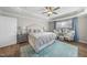 Comfortable main bedroom featuring a ceiling fan, tray ceiling and sitting area at 1916 Edens Ridge Ave, Wake Forest, NC 27587