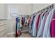 A functional walk-in closet with ample hanging space and built-in drawers at 1916 Edens Ridge Ave, Wake Forest, NC 27587