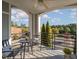 Outdoor balcony space with seating area and view of trees and blue sky at 201 Finsbury St # 201, Durham, NC 27703